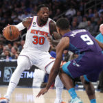 
              New York Knicks forward Julius Randle (30) drives to the basket against Charlotte Hornets guard Theo Maledon (9) during the first half of an NBA basketball game in New York. Wednesday, Oct. 26, 2022. (AP Photo/Noah K. Murray)
            