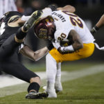
              Colorado safety Trevor Woods, left, pulls down Arizona State wide receiver Giovanni Sanders after Sanders caught a pass for a short gain in the second half of an NCAA college football game Saturday, Oct. 29, 2022, in Boulder, Colo. (AP Photo/David Zalubowski)
            