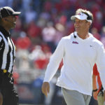 
              Mississippi head coach Lane Kiffin talks with an official during the second half of an NCAA college football game against Kentucky in Oxford, Miss., Saturday, Oct. 1, 2022. Mississippi won 22-19. (AP Photo/Thomas Graning)
            