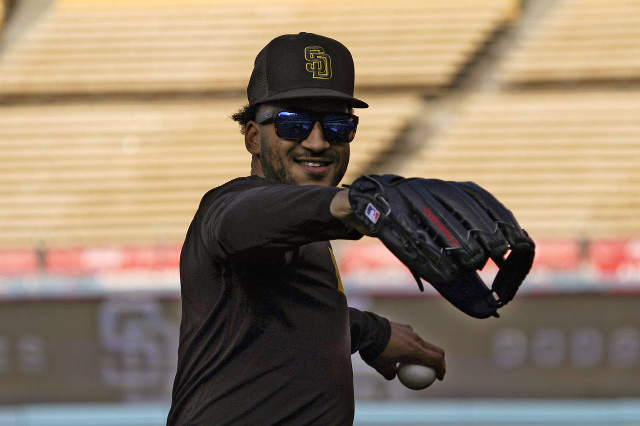 San Diego Padres' Trent Grisham warms up during baseball practice Monday, Oct. 10, 2022, in Los Ang...