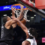 
              Brooklyn Nets forward Nic Claxton, left, dunks against Indiana Pacers guard Buddy Hield, right, during the second half of an NBA basketball game Monday, Oct. 31, 2022, in New York. (AP Photo/Jessie Alcheh)
            