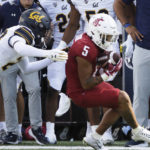 
              Washington State wide receiver Lincoln Victor, right, catches a pass while defended by California cornerback Jeremiah Earby during the first half of an NCAA college football game, Saturday, Oct. 1, 2022, in Pullman, Wash. (AP Photo/Young Kwak)
            