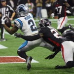 
              Carolina Panthers wide receiver DJ Moore (2) catches a touchdown pass as Atlanta Falcons safety Dean Marlowe (21) defends during the second half of an NFL football game Sunday, Oct. 30, 2022, in Atlanta. (AP Photo/John Amis)
            