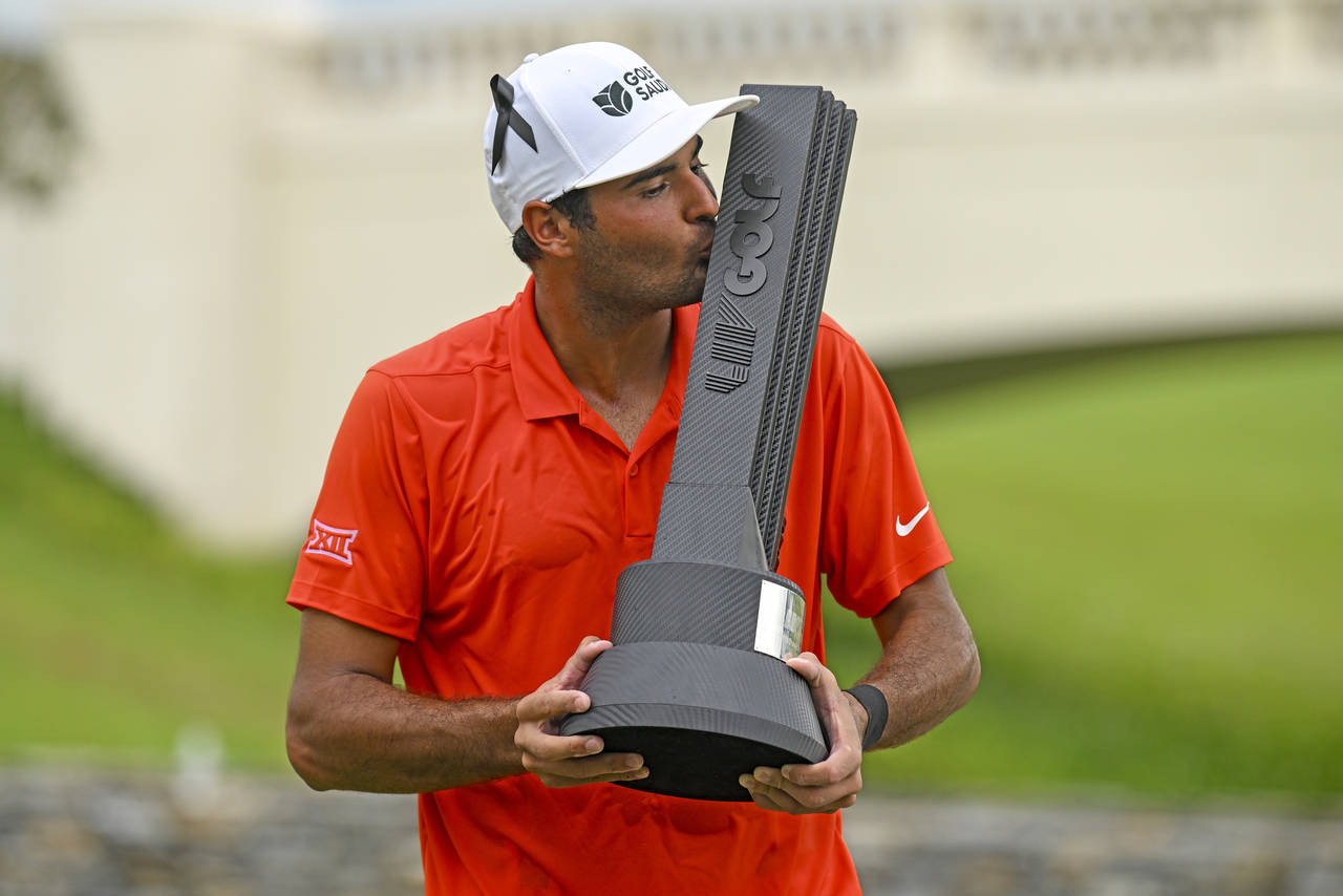 Eugenio Lopez-Chacarra from Spain kisses the winner's trophy after his victory at the LIV Golf Invi...
