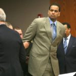 
              FILE - Jayson Williams is handcuffed after he was sentenced to five years in prison Tuesday Feb. 23, 2010, at State Superior Court , in Somerville, N.J., for fatally shooting a hired driver in 2002. The teenage daughters of former NBA All-Star Jayson Williams have denounced St. John’s University for its decision to induct their father into the school’s Athletics Hall of Fame. Tryumph and Whizdom Williams both wrote open letters they sent Friday, Oct. 21, 2022, to The Associated Press, and also planned to send to St. John’s, that said the school should be ashamed for his induction into the class during Saturday’s homecoming weekend. (AP Photo/Kathy Johnson, Pool, File)
            