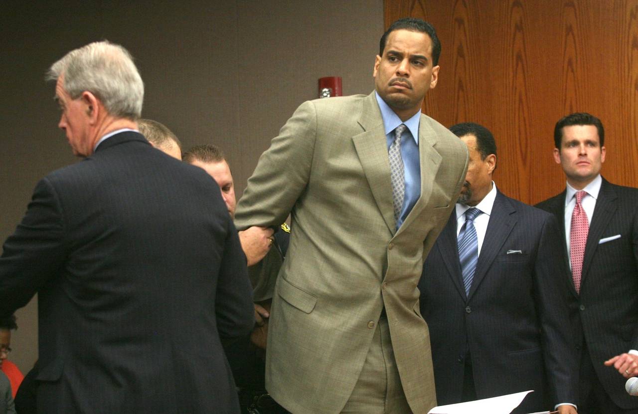 FILE - Jayson Williams is handcuffed after he was sentenced to five years in prison Tuesday Feb. 23...
