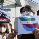 
              Protesters attend a rally to support Iranian competitive climber Elnaz Rekabi, outside the Iranian Embassy in Seoul, South Korea, Wednesday, Oct. 19, 2022. Rekabi received a hero's welcome on her return to Tehran early Wednesday, after competing in South Korea without wearing a mandatory headscarf required of female athletes from the Islamic Republic. (AP Photo/Ahn Young-joon)
            