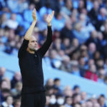 
              Manchester City's head coach Pep Guardiola gestures during the English Premier League soccer match between Manchester City and Southampton at Etihad stadium in Manchester, England, Saturday, Oct. 8, 2022. (AP Photo/Jon Super)
            