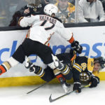 
              Anaheim Ducks right wing Frank Vatrano, left, collides with Boston Bruins right wing David Pastrnak during the first period of an NHL hockey game Thursday, Oct. 20, 2022, in Boston. (AP Photo//Steven Senne)
            