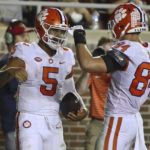 
              Clemson quarterback DJ Uiagalelei (5) celebrates his touchdown with tight end Davis Allen (84) during the second quarter of the team's NCAA college football game against Florida State on Saturday, Oct. 15, 2022, in Tallahassee, Fla. (AP Photo/Phil Sears)
            