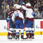 
              Colorado Avalanche players celebrate after a goal against the Vegas Golden Knights during the second period of an NHL hockey game Saturday, Oct. 22, 2022, in Las Vegas. (AP Photo/Chase Stevens)
            