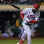 
              Los Angeles Angels' Anthony Rendon tosses his bat after being hit by a pitch thrown by Oakland Athletics starting pitcher Cole Irvin during the sixth inning of a baseball game in Oakland, Calif., Tuesday, Oct. 4, 2022. (AP Photo/Godofredo A. Vásquez)
            