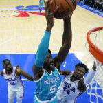 
              Charlotte Hornets' Mark Williams (5) goes up for a dunk past Philadelphia 76ers' Paul Reed (44) during the second half of a preseason NBA basketball game, Wednesday, Oct. 12, 2022, in Philadelphia. (AP Photo/Matt Slocum)
            