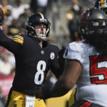 
              Pittsburgh Steelers quarterback Kenny Pickett (8) throws a pass during the first half of an NFL football game against the Tampa Bay Buccaneers in Pittsburgh, Sunday, Oct. 16, 2022. (AP Photo/Barry Reeger)
            