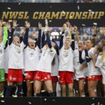 
              FILE - Washington Spirit players celebrate after defeating Chicago Red Stars in the NWSL Championship soccer match Saturday, Nov. 20, 2021, in Louisville, Kentucky. An independent investigation into the scandals that erupted in the National Women's Soccer League last season found emotional abuse and sexual misconduct were systemic in the sport, impacting multiple teams, coaches and players, according to a report released Monday, Oct. 3, 2022. (AP Photo/Jeff Dean, File)
            