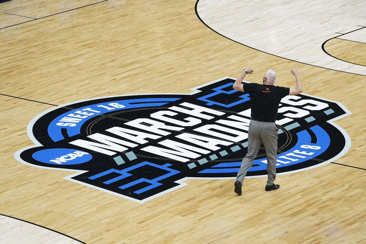 FILE - Oregon State head coach Wayne Tinkle celebrates as he walks off the court after a Sweet 16 g...