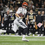 
              Cincinnati Bengals quarterback Joe Burrow (9) runs for a touchdown against the New Orleans Saints during the first half of an NFL football game in New Orleans, Sunday, Oct. 16, 2022. (AP Photo/Butch Dill)
            