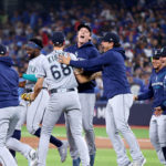 TORONTO, ONTARIO - OCTOBER 08: George Kirby #68 of the Seattle Mariners celebrates with his teammates after defeating the Toronto Blue Jays in game two to win the American League Wild Card Series at Rogers Centre on October 08, 2022 in Toronto, Ontario. The Seattle Mariners defeated the Toronto Blue Jays with a score of 10 to 9. (Photo by Vaughn Ridley/Getty Images)