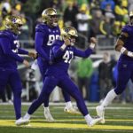Washington placekicker Peyton Henry (47) celebrates ith punter Jack McCallister (38), tight end Quentin Moore (88) and long snapper Jaden Green (89) after making a field goal during the second half of an NCAA college football game against Oregon, Saturday, Nov. 12, 2022, in Eugene, Ore. (AP Photo/Andy Nelson)
