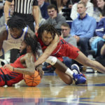 
              Kentucky's Chris Livingston, top left, and Duquesne's Dae Dae Grant, bottom left, and Duquesne's Joe Reece, right, scramble for the ball during the first half of an NCAA college basketball game in Lexington, Ky., Friday, Nov. 11, 2022. (AP Photo/James Crisp)
            