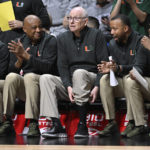 
              Miami head coach Jim Larrañaga, center, watches play in the second half of an NCAA college basketball game against Providence with Director of Basketball Operations Jeff Dyer, left, Associate Head Coach Bill Courtney, second from left, and assistant coaches Kotie Kimble, second from right, and DJ Irving, right, Saturday, Nov. 19, 2022, in Uncasville, Conn. (AP Photo/Jessica Hill)
            