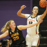 
              Iowa forward Monika Czinano (25) defends against Oregon State forward Jelena Mitrovic (12) during the first half of an NCAA college basketball game in the Phil Knight Legacy tournament Friday, Nov. 25, 2022, in Portland, Ore. (AP Photo/Rick Bowmer)
            