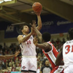 
              San Diego State guard Matt Bradley (20) shoots over the Ohio State defense during the second half of an NCAA college basketball game, Monday, Nov. 21, 2022, in Lahaina, Hawaii. (AP Photo/Marco Garcia)
            