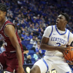 
              Kentucky's Adou Thiero (3) looks for an opening against South Carolina State's Dallas James, left, during the second half of an NCAA college basketball game in Lexington, Ky., Thursday, Nov. 17, 2022. (AP Photo/James Crisp)
            