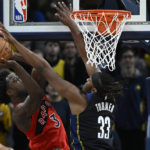 
              Toronto Raptors forward O.G. Anunoby (3) shoots against Indiana Pacers center Myles Turner (33) during the second half of an NBA basketball game, Saturday, Nov. 12, 2022, in Indianapolis, Ind. (AP Photo/Marc Lebryk)
            