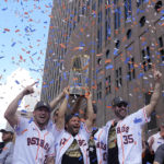 
              Houston Astros players celebrate during a victory parade for the World Series baseball champions Monday, Nov. 7, 2022, in Houston. (AP Photo/David J. Phillip)
            