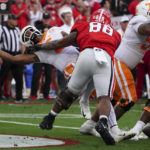 
              Tennessee quarterback Hendon Hooker, left, fumbles as he is hit by Georgia defensive lineman Jalen Carter (88) in the end zone during the first half of an NCAA college football game Saturday, Nov. 5, 2022, in Athens, Ga. Tennessee recovered the ball and avoided a safety. (AP Photo/John Bazemore)
            
