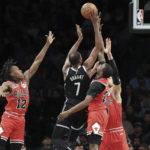 
              Brooklyn Nets forward Kevin Durant (7) shoots against the Chicago Bulls, including Ayo Dosunmu (12) and Javonte Green (24), during the first half of an NBA basketball game Tuesday, Nov. 1, 2022, in New York. (AP Photo/Jessie Alcheh)
            