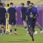 
              United States defender Deandre Yedlin, right, and other players participate in an official training session at Al-Gharafa SC Stadium, in Doha, Saturday, Nov. 19, 2022. (AP Photo/Ashley Landis)
            