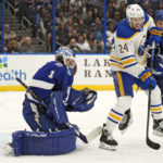 
              Tampa Bay Lightning goaltender Brian Elliott (1) makes a save on a deflected shot by Buffalo Sabres center Dylan Cozens (24) during the first period of an NHL hockey game Saturday, Nov. 5, 2022, in Tampa, Fla. (AP Photo/Chris O'Meara)
            
