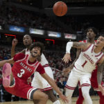 
              Miami (Ohio) guard Julian Lewis (3) and Indiana guard Jalen Hood-Schifino (1) react during the first half of an NCAA college basketball game, Sunday, Nov. 20, 2022, in Indianapolis. (AP Photo/Marc Lebryk)
            