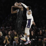 
              Los Angeles Lakers guard Russell Westbrook, right, blocks a shot by Brooklyn Nets forward Kevin Durant (7) during the first half of an NBA basketball game in Los Angeles, Sunday, Nov. 13, 2022. (AP Photo/Ashley Landis)
            