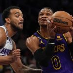 
              Los Angeles Lakers guard Russell Westbrook, right, goes up for a shot as Sacramento Kings forward Trey Lyles defends during the first half of an NBA basketball game Friday, Nov. 11, 2022, in Los Angeles. (AP Photo/Mark J. Terrill)
            