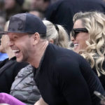 
              Singer Donnie Wahlberg, left, and his actress wife Jenny McCarthy Wahlberg react court-side as they watch an NBA basketball game between the Chicago Bulls and the Boston Celtics Monday, Nov. 21, 2022, in Chicago. (AP Photo/Charles Rex Arbogast)
            