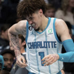
              Charlotte Hornets guard LaMelo Ball reacts after being shaken up on a play during the second half of the team's NBA basketball game against the Indiana Pacers in Charlotte, N.C., Wednesday, Nov. 16, 2022. (AP Photo/Jacob Kupferman)
            