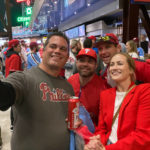 
              Jayme Hoskins, right, wife of Philadelphia Phillies first baseman Rhys Hoskins, poses with fans at Game 4 of the baseball World Series between the Phillies and the Houston Astros on Wednesday. Nov. 2, 2022, in Philadelphia. Hoskins tweeted she would buy fans beer before the game at Section 104 of the stadium. She paid for about 100 beers. (AP Photo/Daniel Gelston)
            