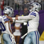 
              Dallas Cowboys running back Tony Pollard celebrates with teammate quarterback Dak Prescott (4) after catching a 30-yard touchdown pass during the first half of an NFL football game against the Minnesota Vikings, Sunday, Nov. 20, 2022, in Minneapolis. (AP Photo/Bruce Kluckhohn)
            