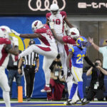 
              Arizona Cardinals wide receiver A.J. Green, top center, celebrates his touchdown catch with teammates during the first half of an NFL football game against the Los Angeles Rams Sunday, Nov. 13, 2022, in Inglewood, Calif. (AP Photo/Mark J. Terrill)
            