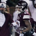
              Mississippi State wide receiver Zavion Thomas (87) returns a punt 63-yards for a touchdown during the first half of an NCAA college football game against Georgia in Starkville, Miss., Saturday, Nov. 12, 2022. (AP Photo/Rogelio V. Solis)
            