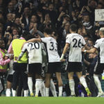 
              Fulham's Daniel James celebrates with teammates after scoring his side's opening goal during the English Premier League soccer match between Fulham and Manchester United at the Craven Cottage stadium in London, Sunday, Nov. 13, 2022. (AP Photo/Leila Coker)
            