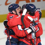 
              Washington Capitals left wing Alex Ovechkin, left, celebrates his goal with center Dylan Strome (17) and others in the overtime of an NHL hockey game against the Philadelphia Flyers, Wednesday, Nov. 23, 2022, in Washington. The Capitals won 3-2 in overtime. (AP Photo/Nick Wass)
            