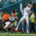 
              Miami Dolphins wide receiver Trent Sherfield (14) catches a touchdown pass as Cleveland Browns cornerback Martin Emerson Jr. (23) is late with the tackle during the first half of an NFL football game, Sunday, Nov. 13, 2022, in Miami Gardens, Fla. (AP Photo/Lynne Sladky)
            