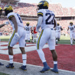 
              Michigan Cornelius Johnson, center, celebrates with teammates after his touchdown against Ohio State during the first half of an NCAA college football game on Saturday, Nov. 26, 2022, in Columbus, Ohio. (AP Photo/Jay LaPrete)
            