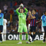 
              Barcelona's Sergio Busquets, left, and Barcelona's goalkeeper Marc-Andre ter Stegen applauds fans at the end of the Champions League Group C soccer match between Barcelona and Bayern Munich at the Camp Nou stadium in Barcelona, Spain, Wednesday, Oct. 26, 2022. (AP Photo/Joan Monfort)
            