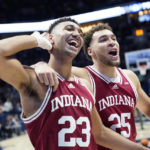 
              Indiana forwards Trayce Jackson-Davis (23) and Race Thompson (25) gesture to the student section after their victory over Xavier in an NCAA college basketball game, Friday, Nov. 18, 2022, in Cincinnati. (AP Photo/Joshua A. Bickel)
            