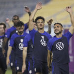 
              United States midfielder Cristian Roldan, right, and other players participate in an official training session at Al-Gharafa SC Stadium, in Doha, Saturday, Nov. 19, 2022. (AP Photo/Ashley Landis)
            